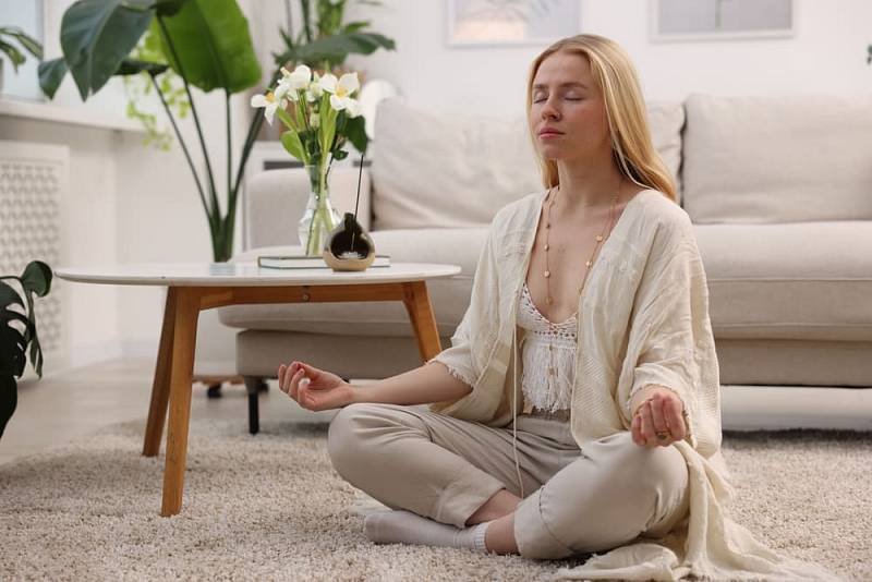 Feng,Shui.,Young,Woman,Meditating,On,Floor,At,Home